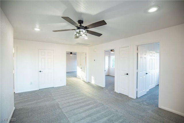 carpeted empty room with ceiling fan