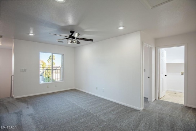 empty room featuring carpet, a textured ceiling, and ceiling fan