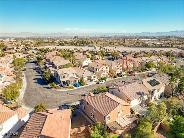 birds eye view of property featuring a mountain view