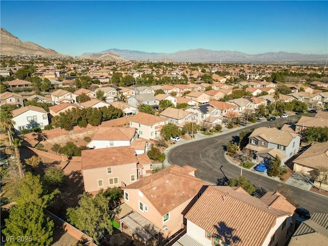 birds eye view of property featuring a mountain view