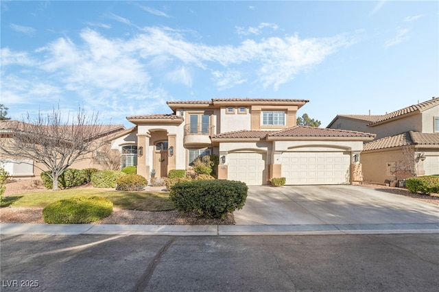 mediterranean / spanish home with a garage