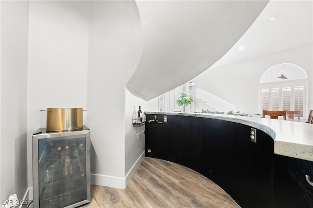 interior space with hardwood / wood-style flooring and wine cooler