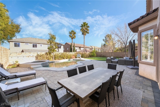 view of patio with a swimming pool with hot tub and an outdoor hangout area