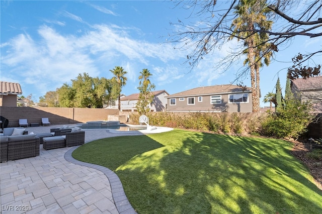 view of yard with an outdoor living space and a patio area