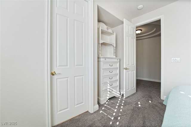 unfurnished bedroom featuring carpet flooring and a closet