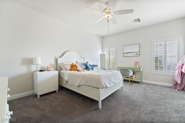 bedroom with ceiling fan and dark carpet