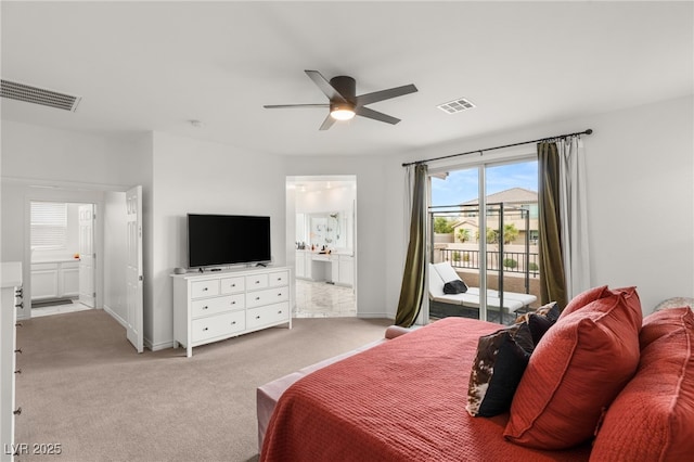 bedroom featuring ceiling fan, light carpet, access to outside, and ensuite bath