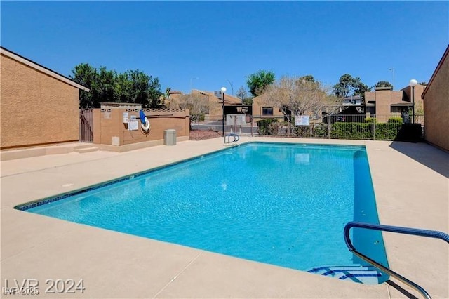 view of swimming pool featuring a patio