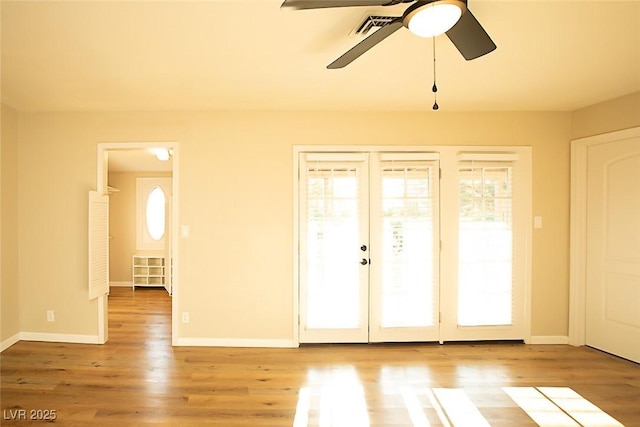 interior space featuring french doors, ceiling fan, and hardwood / wood-style floors