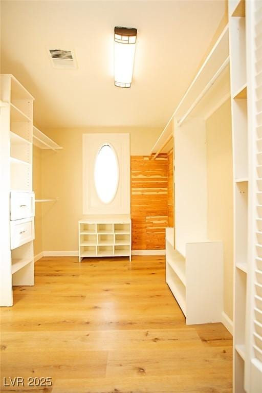 spacious closet featuring hardwood / wood-style floors