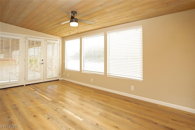 interior space with vaulted ceiling, wooden ceiling, ceiling fan, and french doors