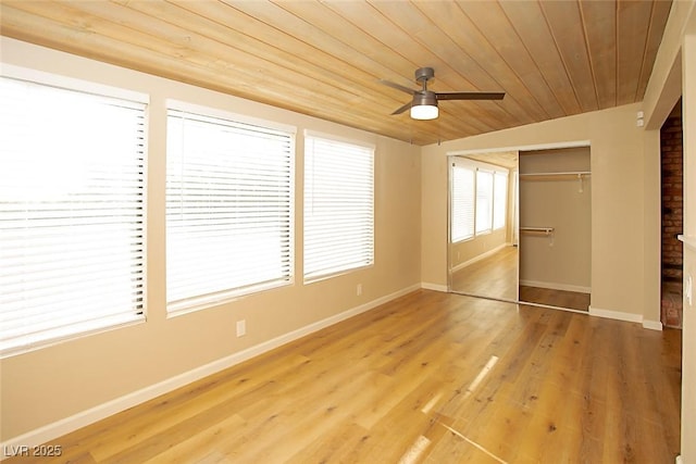 unfurnished bedroom with vaulted ceiling, wood-type flooring, ceiling fan, wooden ceiling, and a closet