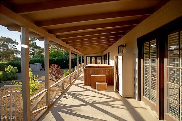 view of patio / terrace with a hot tub