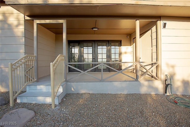 view of exterior entry featuring french doors