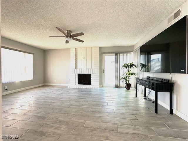 unfurnished living room featuring a fireplace and ceiling fan