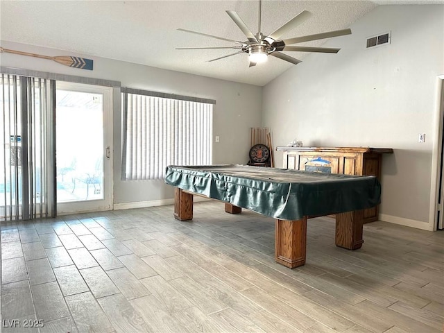 recreation room featuring ceiling fan, a wealth of natural light, pool table, and vaulted ceiling