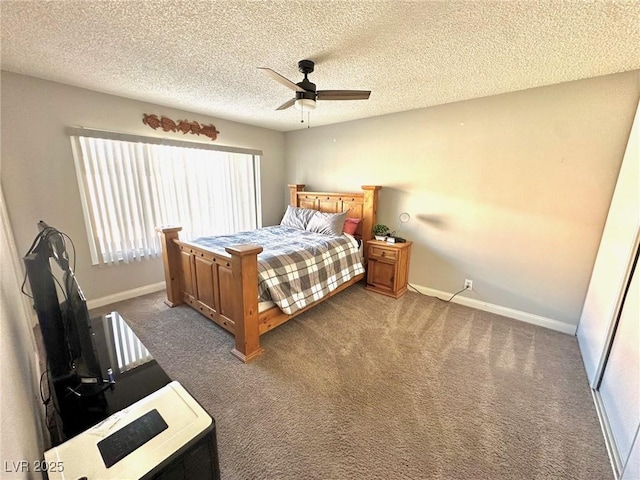 bedroom featuring ceiling fan, carpet, and a textured ceiling