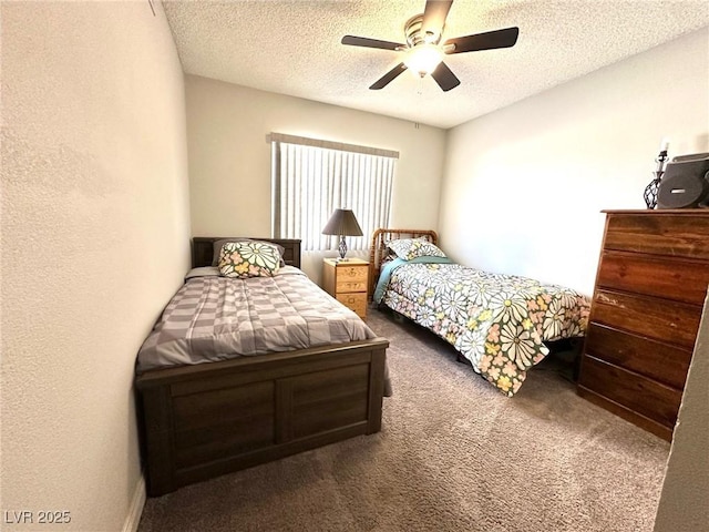 carpeted bedroom featuring a textured ceiling and ceiling fan