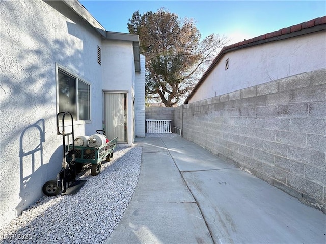 view of property exterior featuring a patio