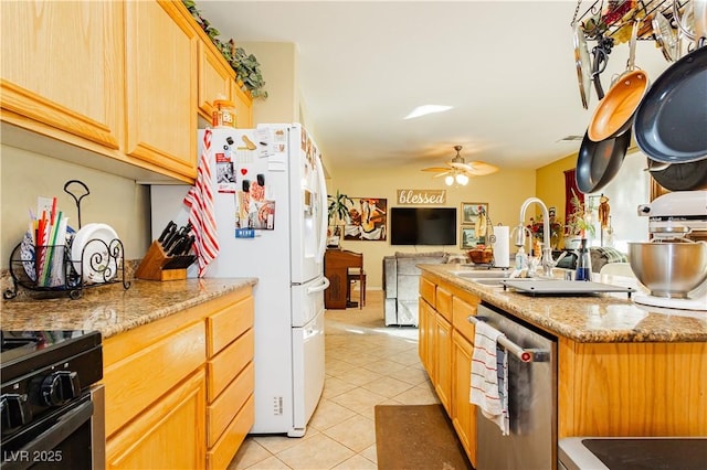 kitchen featuring light stone countertops, ceiling fan, light tile patterned floors, white refrigerator, and dishwasher