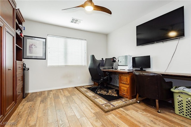 office with ceiling fan and light hardwood / wood-style flooring