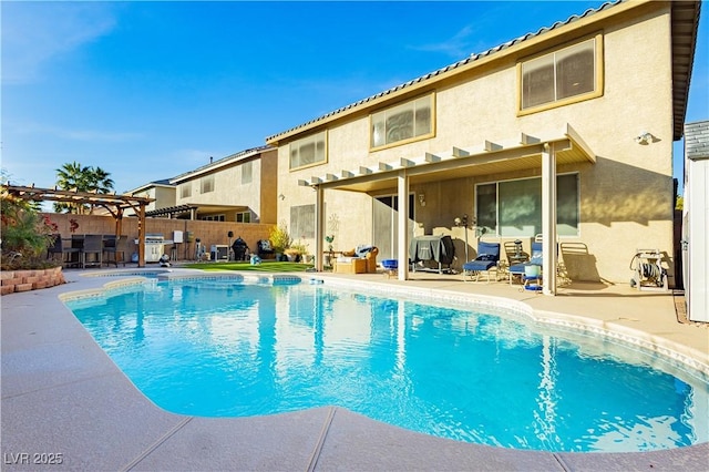 view of pool with a pergola and a patio area