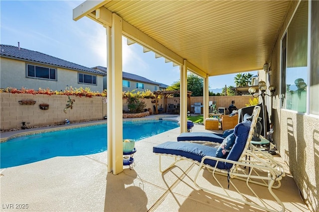 view of swimming pool with a patio area