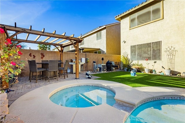 view of pool with a pergola, area for grilling, exterior bar, a jacuzzi, and a lawn