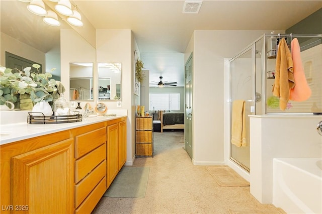 bathroom with vanity, ceiling fan, and a shower with shower door