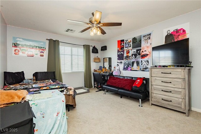 bedroom with ceiling fan and light carpet