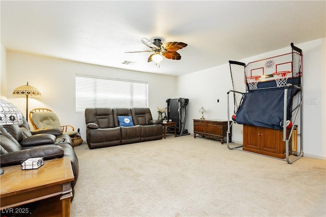 living room with ceiling fan and carpet floors