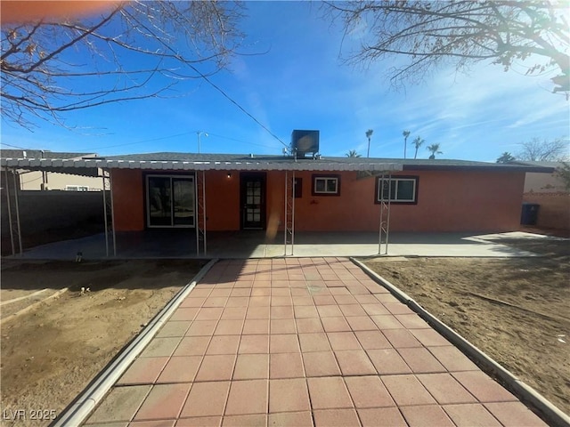 back of house with cooling unit and a patio area