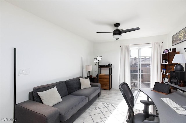 office space featuring ceiling fan and light hardwood / wood-style flooring