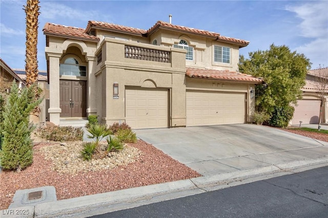 mediterranean / spanish house with a garage