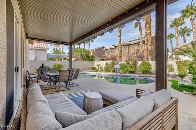 view of patio with a fenced in pool and an outdoor hangout area