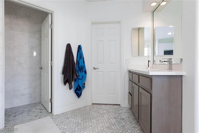 bathroom featuring tile patterned flooring and vanity