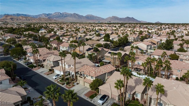 birds eye view of property with a mountain view