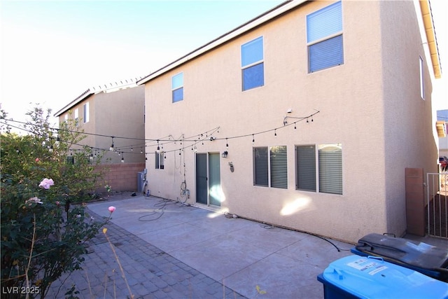 back of house with a patio