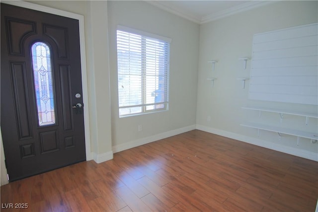 foyer entrance with hardwood / wood-style floors and ornamental molding