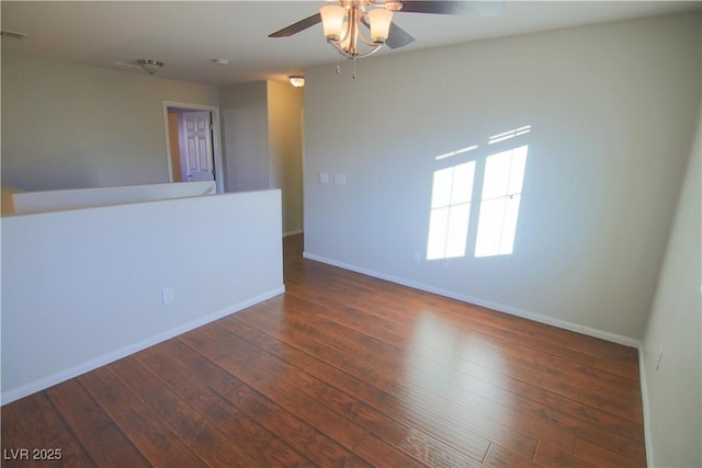 unfurnished room featuring dark hardwood / wood-style flooring and ceiling fan