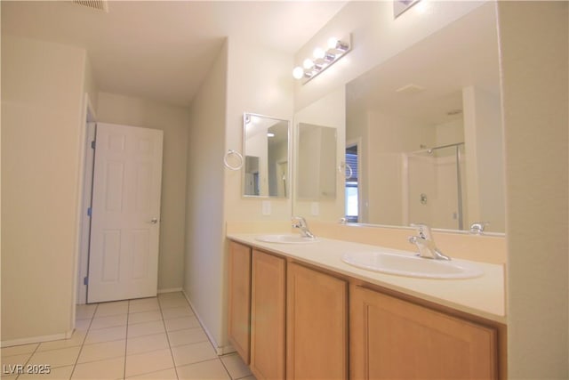 bathroom featuring a shower, tile patterned flooring, and vanity