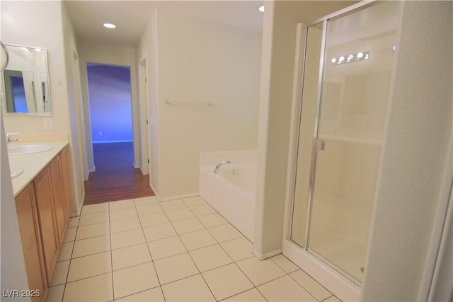 bathroom featuring tile patterned floors, vanity, and separate shower and tub