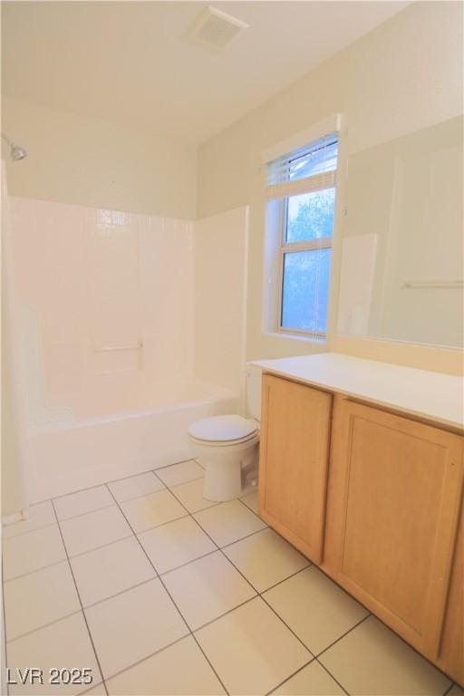 full bathroom featuring tile patterned flooring, vanity, bathtub / shower combination, and toilet