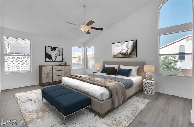 bedroom with high vaulted ceiling, light hardwood / wood-style flooring, and ceiling fan