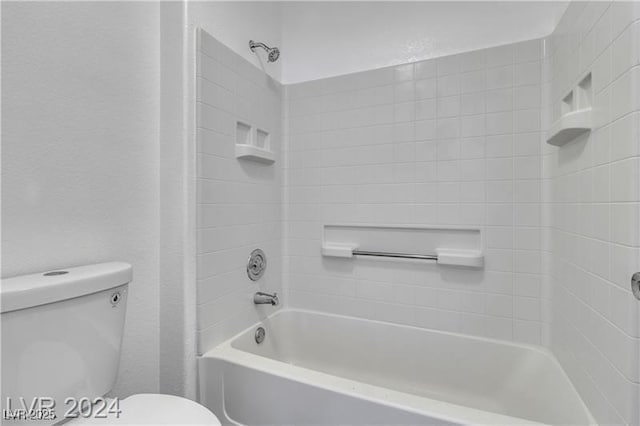 bathroom with shower / bathtub combination and toilet