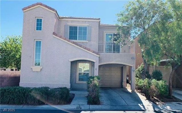 view of front of home with a garage and a balcony