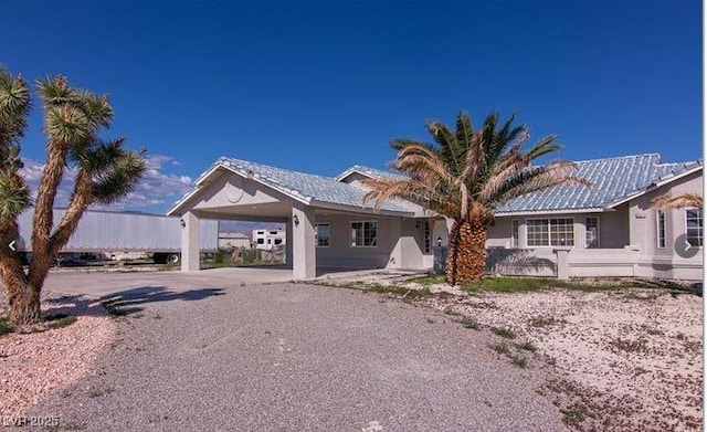 ranch-style home with a carport