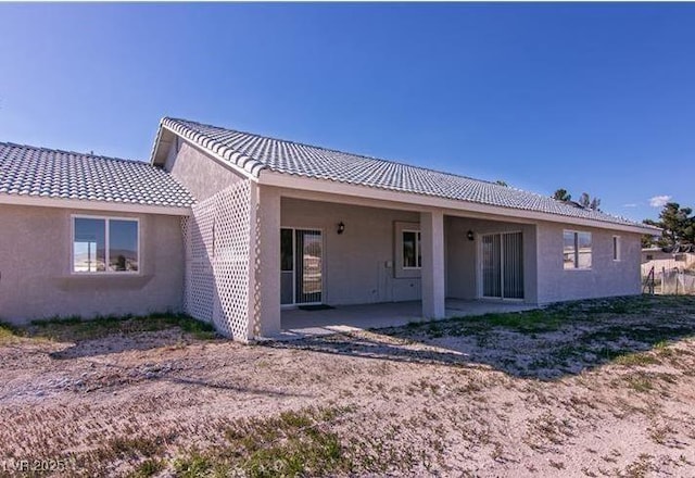 rear view of property featuring a patio