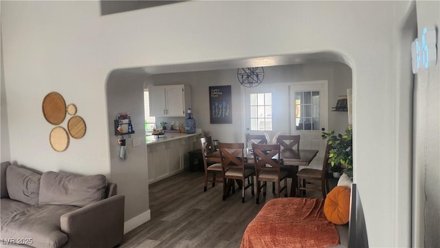 dining space with dark wood-type flooring