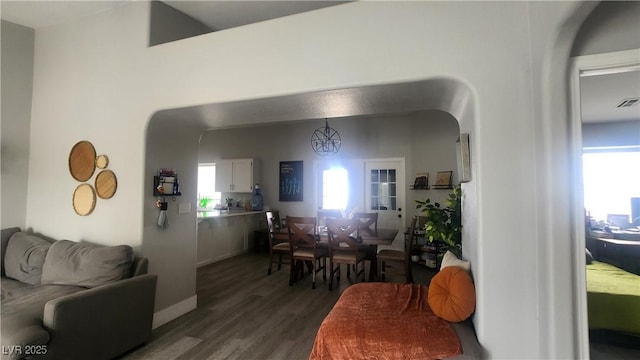 dining space featuring dark wood-type flooring